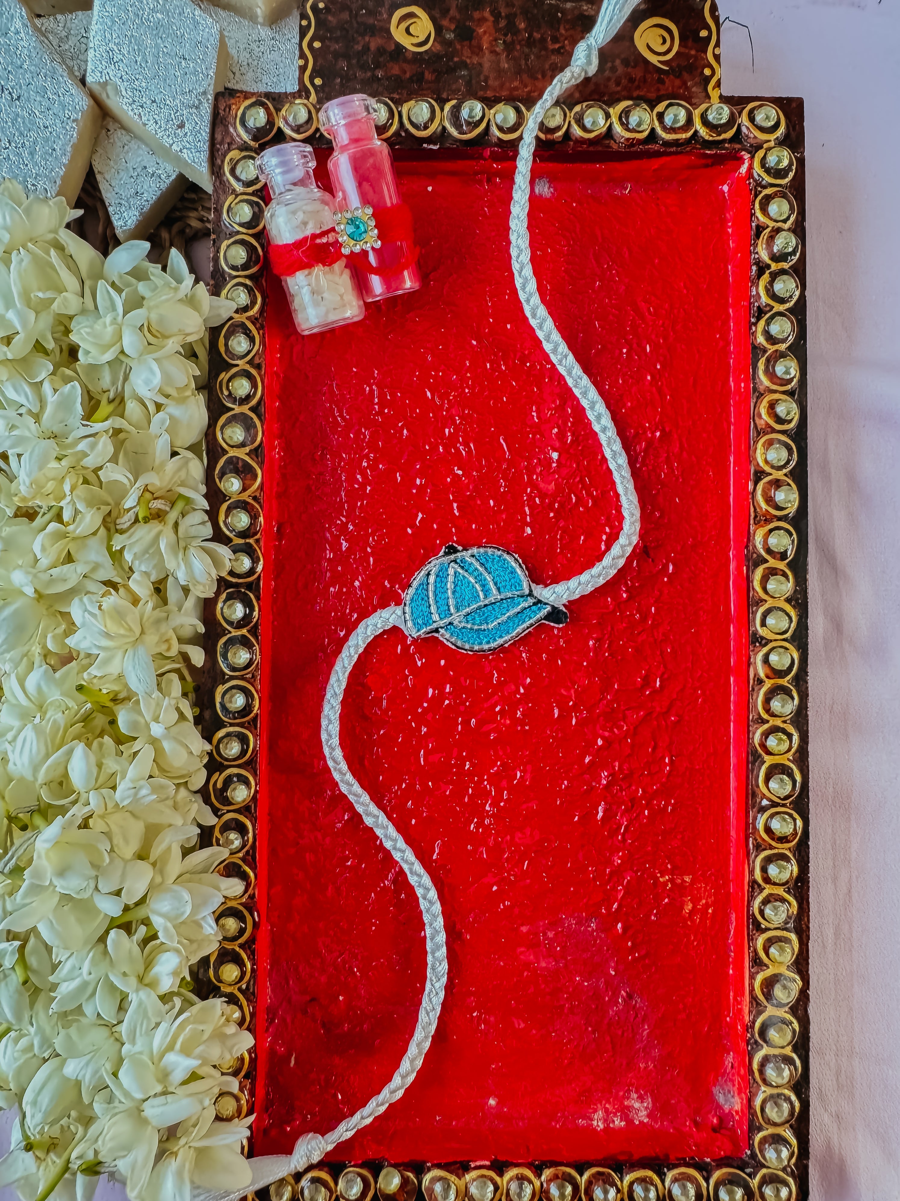 Blue Cap Charm Handmade Rakhi